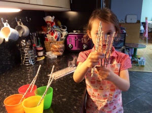 Put each straw into a beaker.
